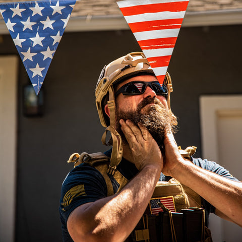 man rubbing his clean beard