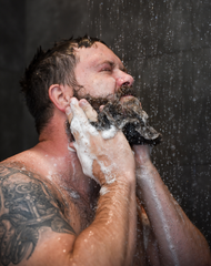 Charlie from Badass Beard Care using Badass Beard Wash to clean his beard and face